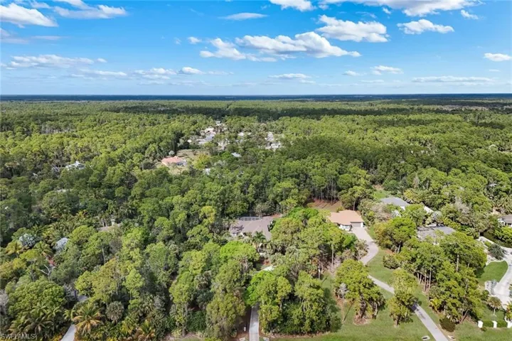 Aerial overview of property's location with a forest