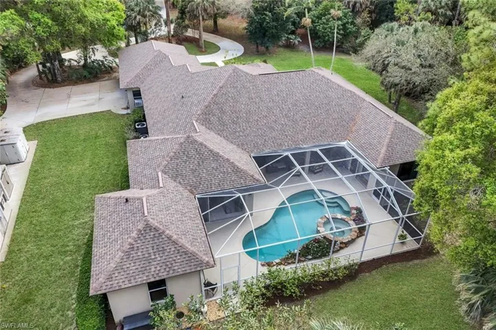View of subject property with a pool area