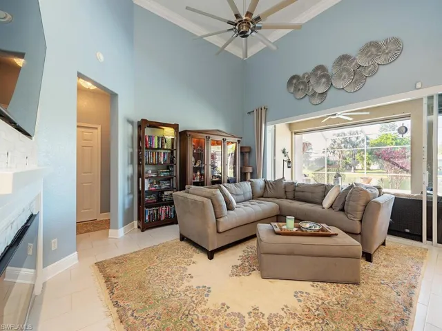 3760 Baldwin Ln, Naples FL 34116 - Living area with pocketing slider access to lanai