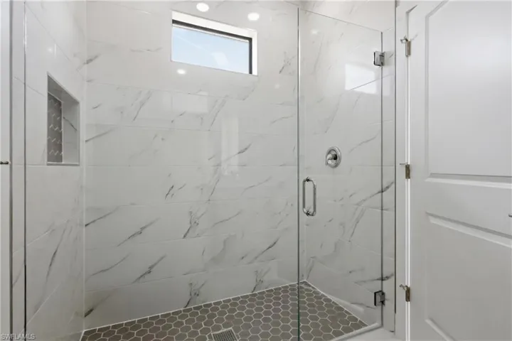 Full bathroom featuring a marble finish shower