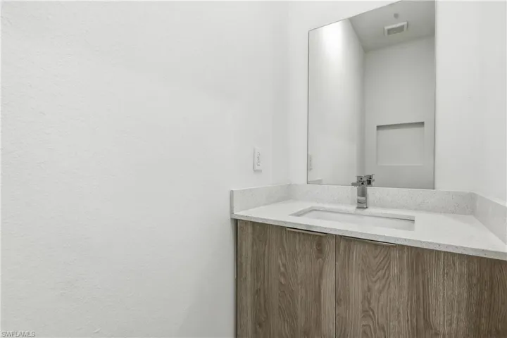 Powder Bathroom featuring vanity
