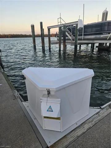 Dock area featuring a water view