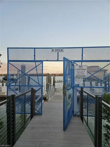 Dock area featuring a water view