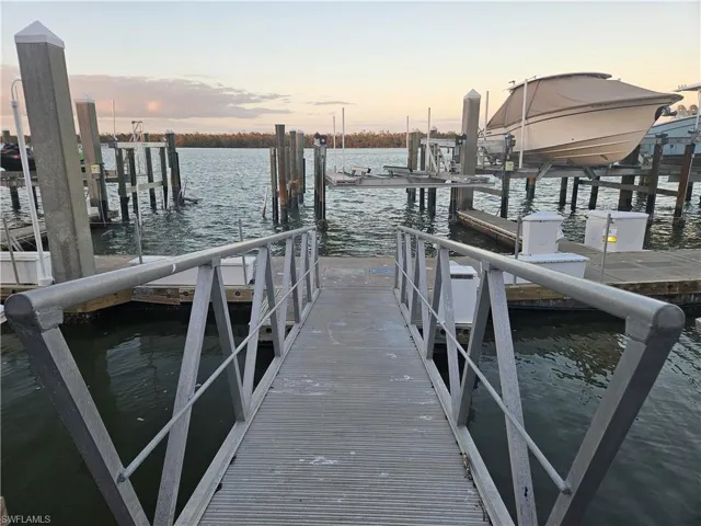 Dock area featuring a water view