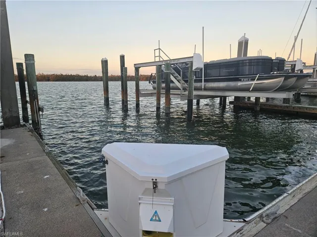 Dock area featuring a water view