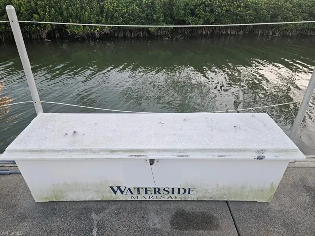 Dock area featuring a water view