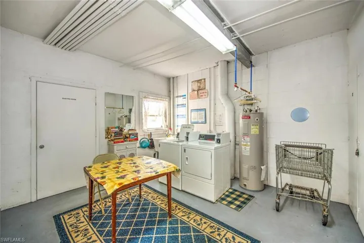 Clothes washing area with washer and dryer and water heater
