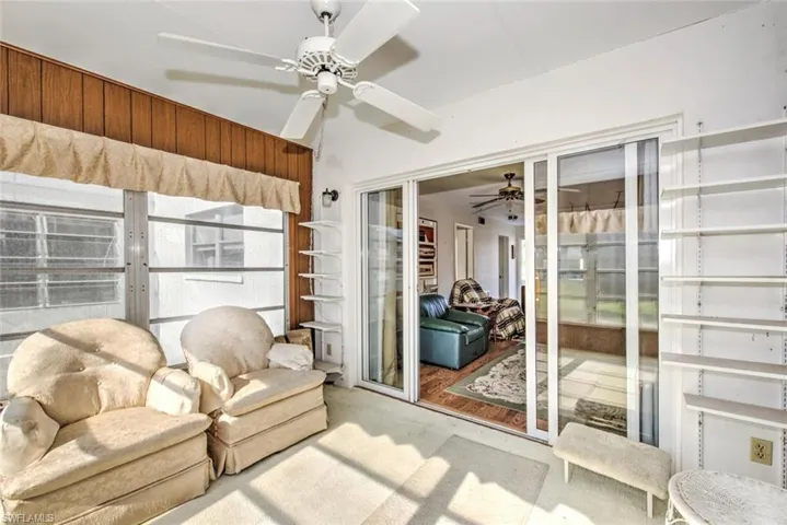 Sunroom featuring ceiling fan