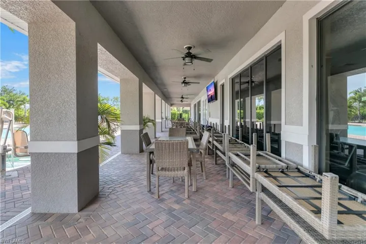 View of patio / terrace featuring a pool and ceiling fan