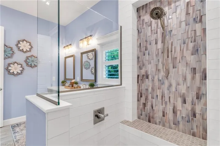 Bathroom featuring tiled shower