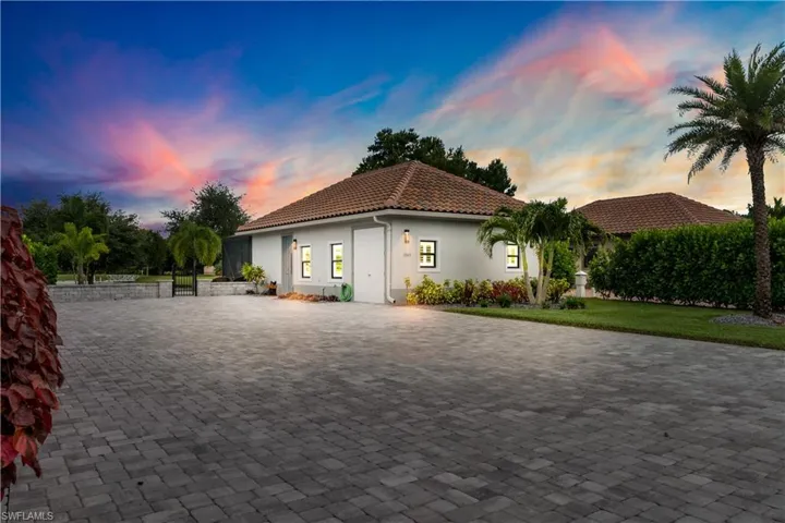 Mediterranean / spanish home with a yard
