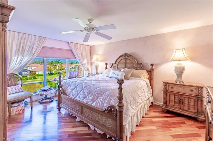 Bedroom featuring ceiling fan and light wood-type flooring