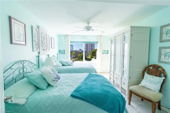 Carpeted bedroom with ceiling fan