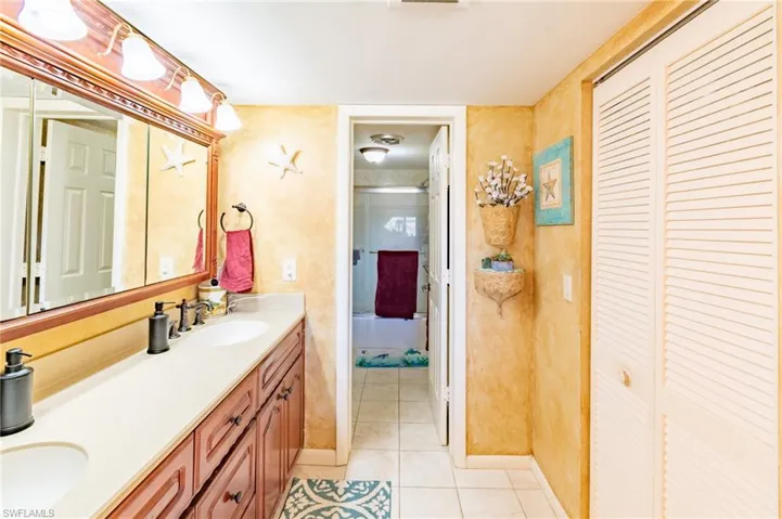 Bathroom with tile patterned flooring and vanity