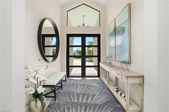 Entrance foyer with high vaulted ceiling