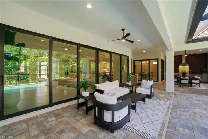View of patio featuring outdoor lounge area and a ceiling fan