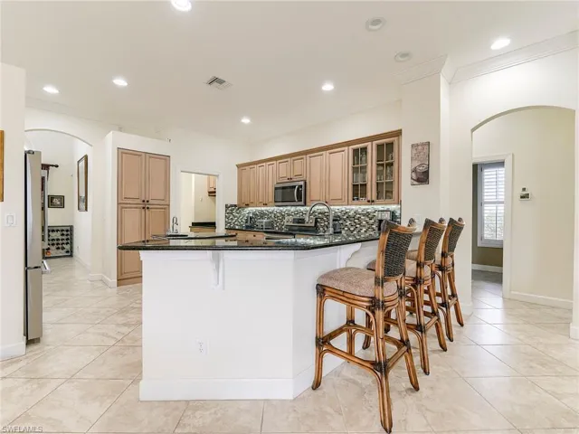 Breakfast or serving bar for entertaining.  Entrance to guest bedrooms 2 and 3 to the right.