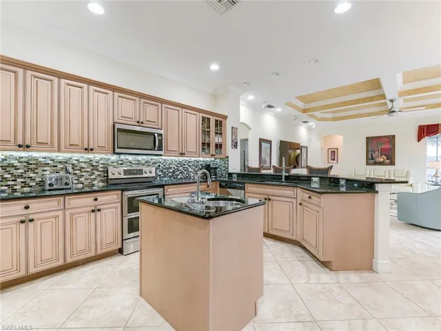 Light wood cabinetry with roll out drawers