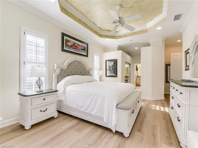 Master bedroom.  All bedrooms have new wood flooring and plantation shutters.