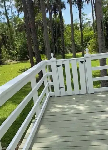 Deck featuring a lawn