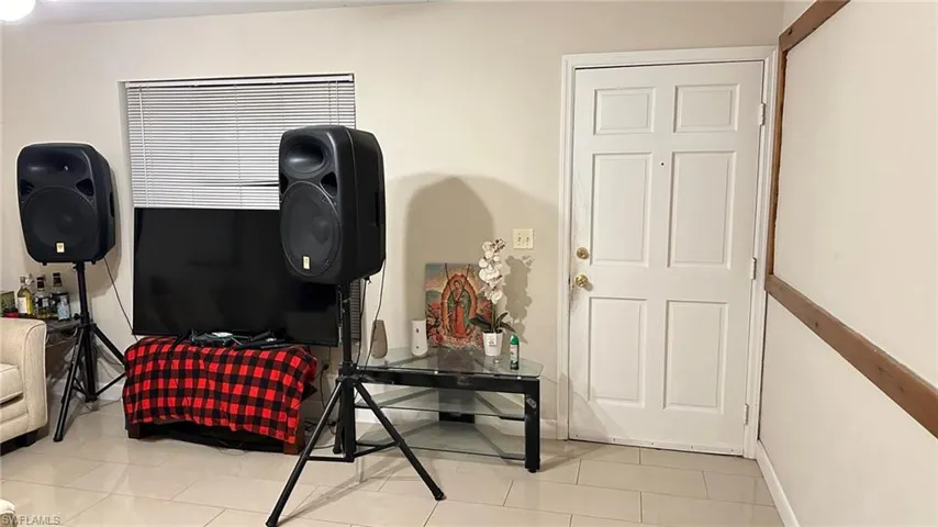 Bedroom with light tile patterned floors