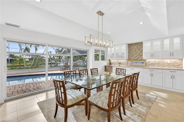 Dining room featuring recessed lighting and light tile patterned flooring