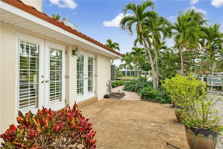 View of yard featuring a patio and french doors