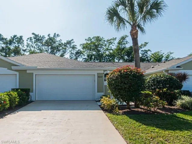 Single story home featuring a garage