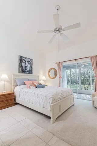 Bedroom featuring ceiling fan and light colored carpet