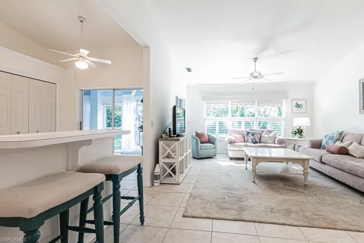 Tiled living room with ceiling fan