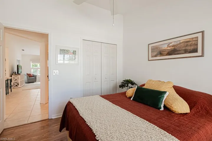 2nd Tiled bedroom featuring a closet