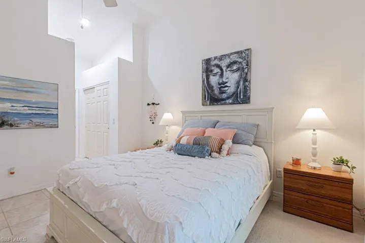Master Bedroom featuring ceiling fan, vaulted ceiling, and a closet
