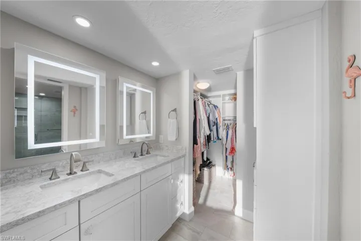 En-Suite Primary Bathroom, Custom Built Walk-in Closet & Cabinets