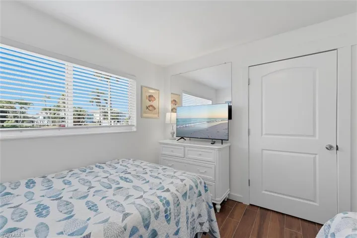 Bedroom featuring dark wood-type flooring