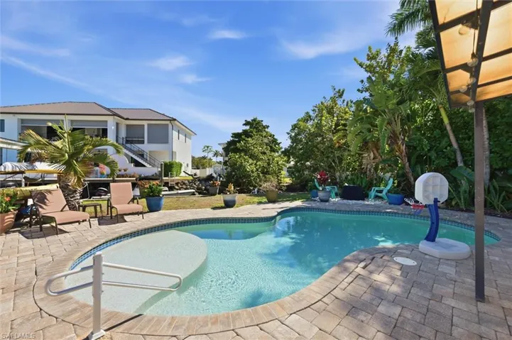 Swimming pool with a patio