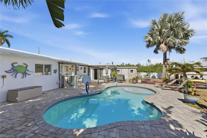 View of swimming pool with patio surround