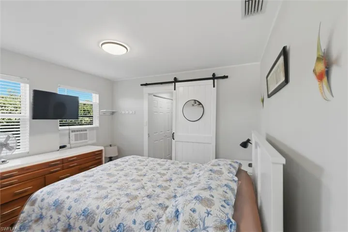 Bedroom with a barn door