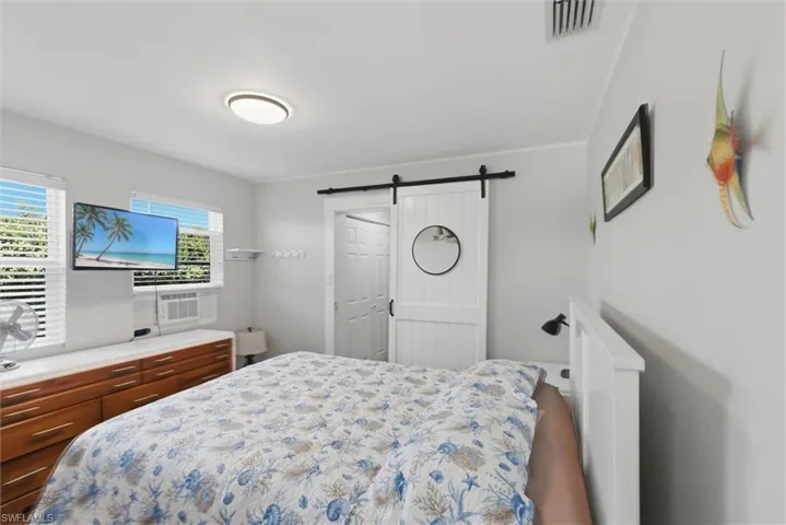 Bedroom featuring a barn door
