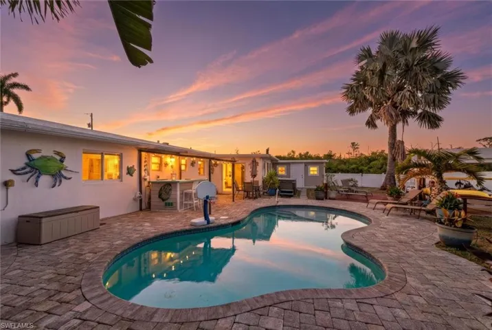 View of swimming pool featuring patio surround