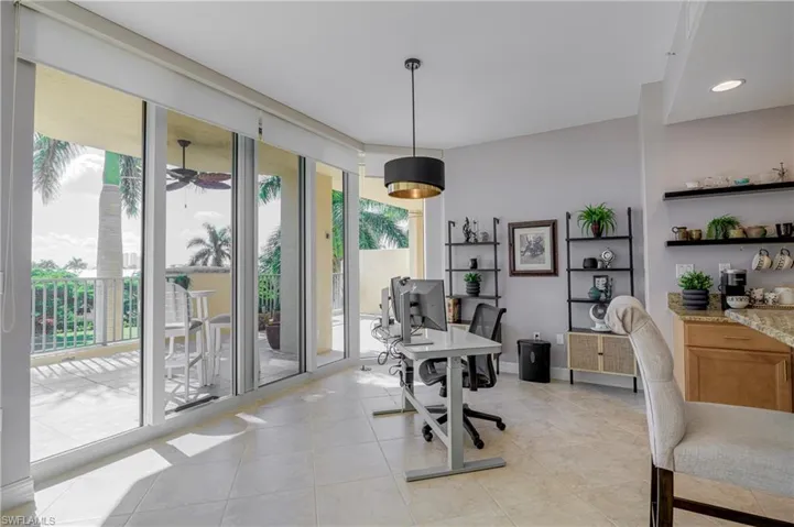 Floor-to-ceiling sliding glass doors opening to a private balcony