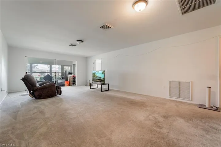 Living area featuring carpet