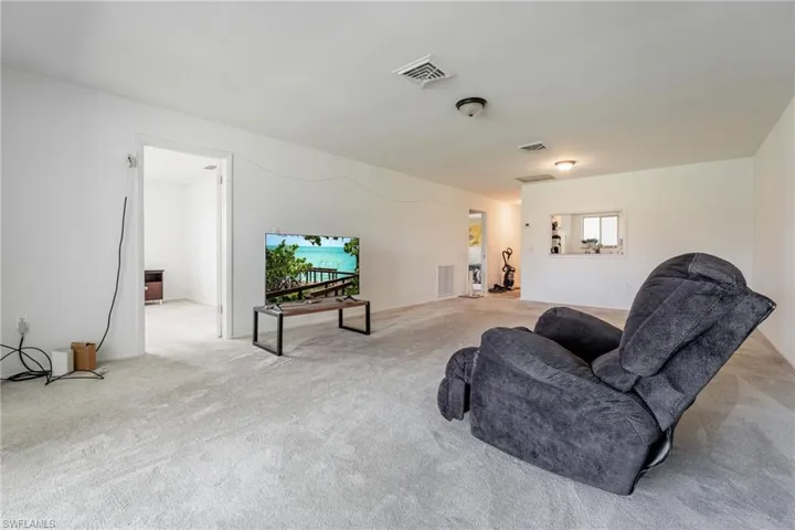 Living area with carpet flooring