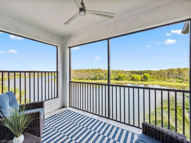 Lanai featuring a water view and ceiling fan