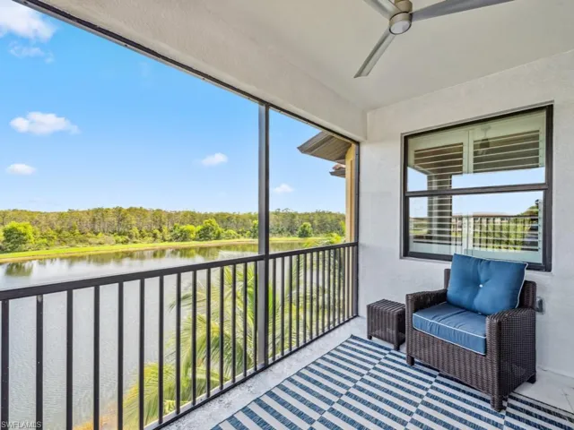 Lanai featuring a water view and ceiling fan
