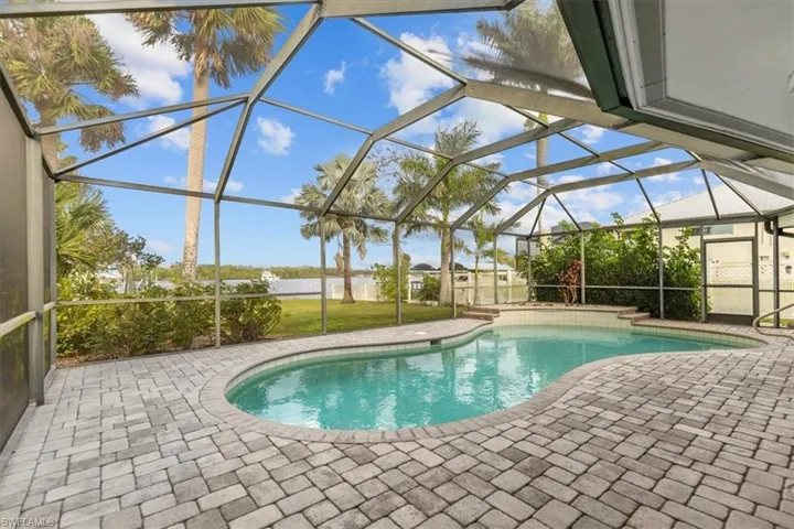 View of pool featuring a patio and a lanai