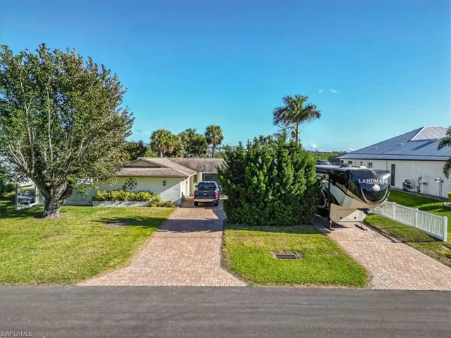 View of front of property with a front lawn