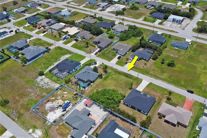 Aerial overview of property's location featuring nearby suburban area
