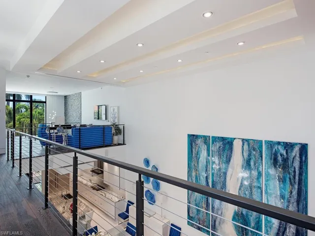Hall featuring beam ceiling and hardwood / wood-style flooring