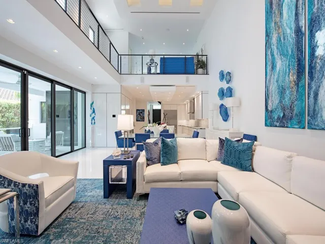 Living room featuring a towering ceiling