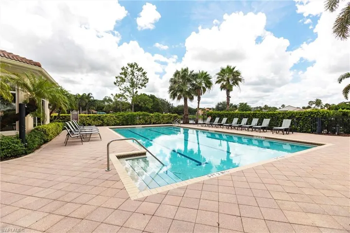 Community lap pool with a patio area